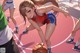 A girl dribbling a basketball on a basketball court.